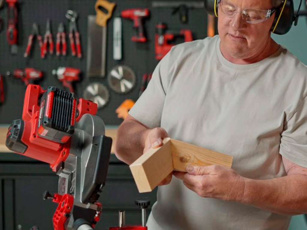 A man works with a circular saw