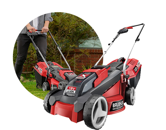 A woman is working with a cordless lawn mower